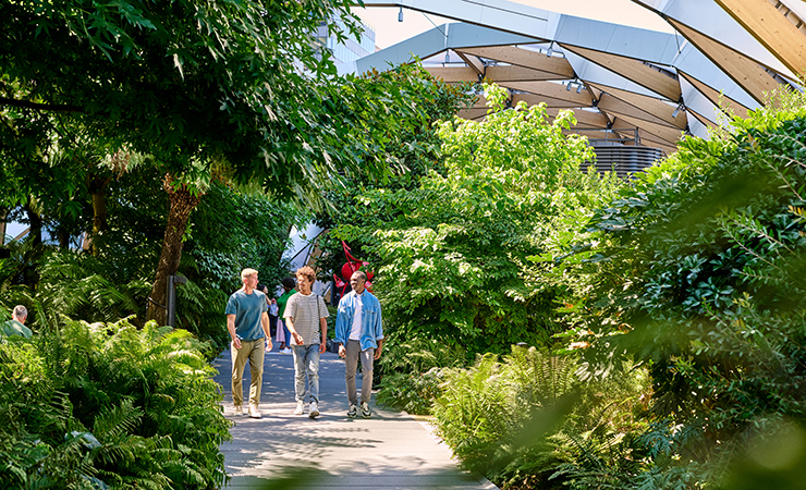 People walking through Crossrail Place Roof Garden