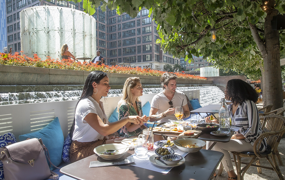 People eating outdoors in Cabot Square