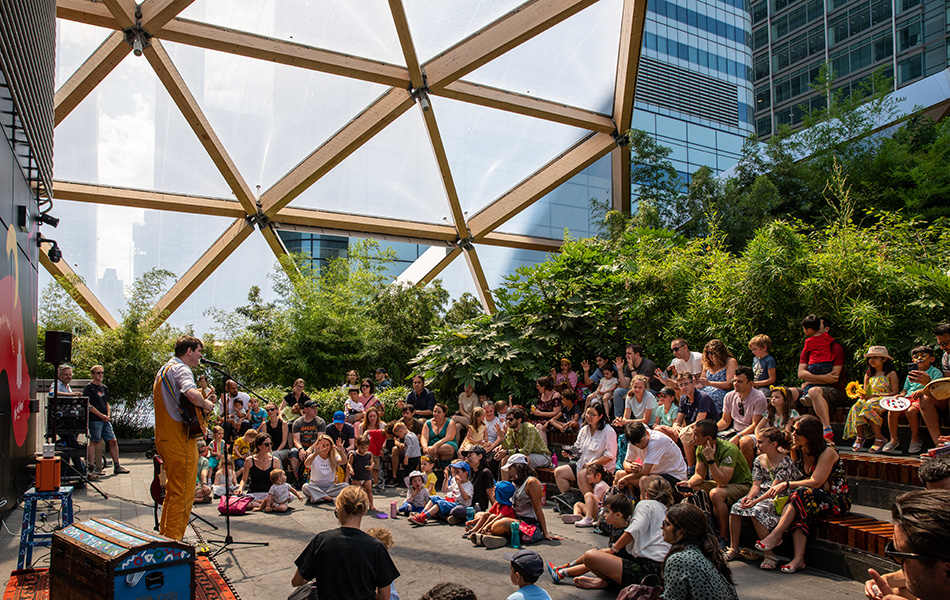 People enjoying family activities in Crossrail Place Roof Garden