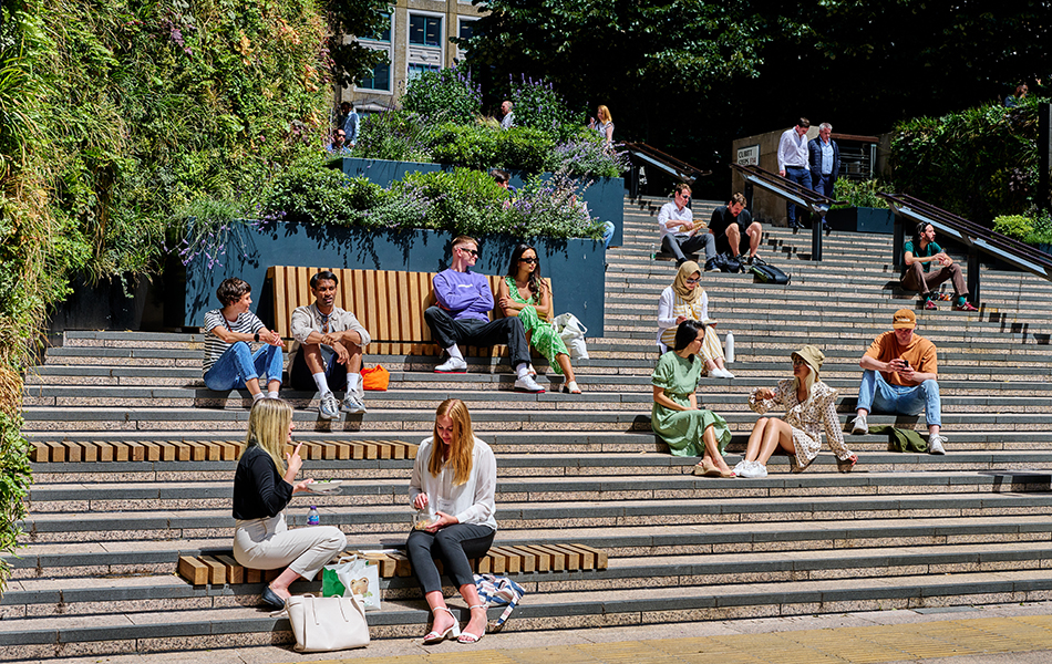 People sitting in the sunshine on steps