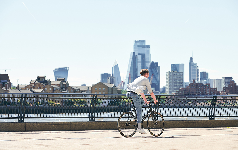 Man cycling along he riverside