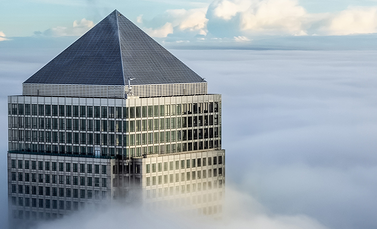 Top of One Canada Square through low clouds